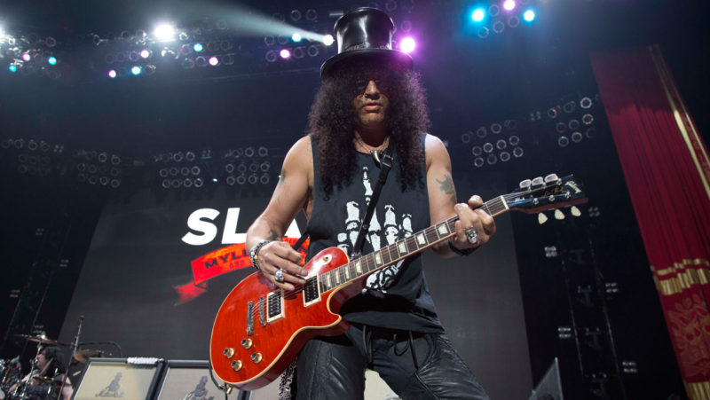Slash leads his band at the Los Angeles Forum.